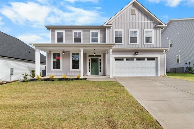 view of front of house with covered porch, an attached garage, board and batten siding, driveway, and a front lawn