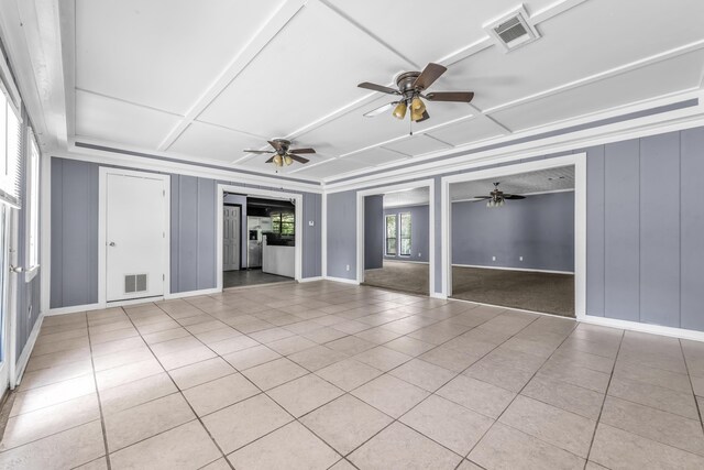 1736 Goshen Rd, Augusta, GA 30906 - unfurnished living room with a ceiling fan, coffered ceiling, light tile patterned floors, and a decorative wall