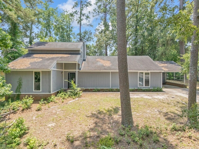 1736 Goshen Rd, Augusta, GA 30906 - mid-century modern home featuring an attached carport, concrete driveway, and roof with shingles