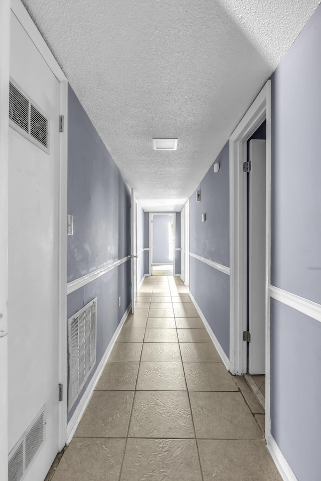 1736 Goshen Rd, Augusta, GA 30906 - hall with a textured ceiling and tile patterned flooring