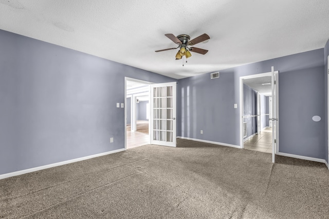1736 Goshen Rd, Augusta, GA 30906 - unfurnished room with a ceiling fan, french doors, carpet, and a textured ceiling