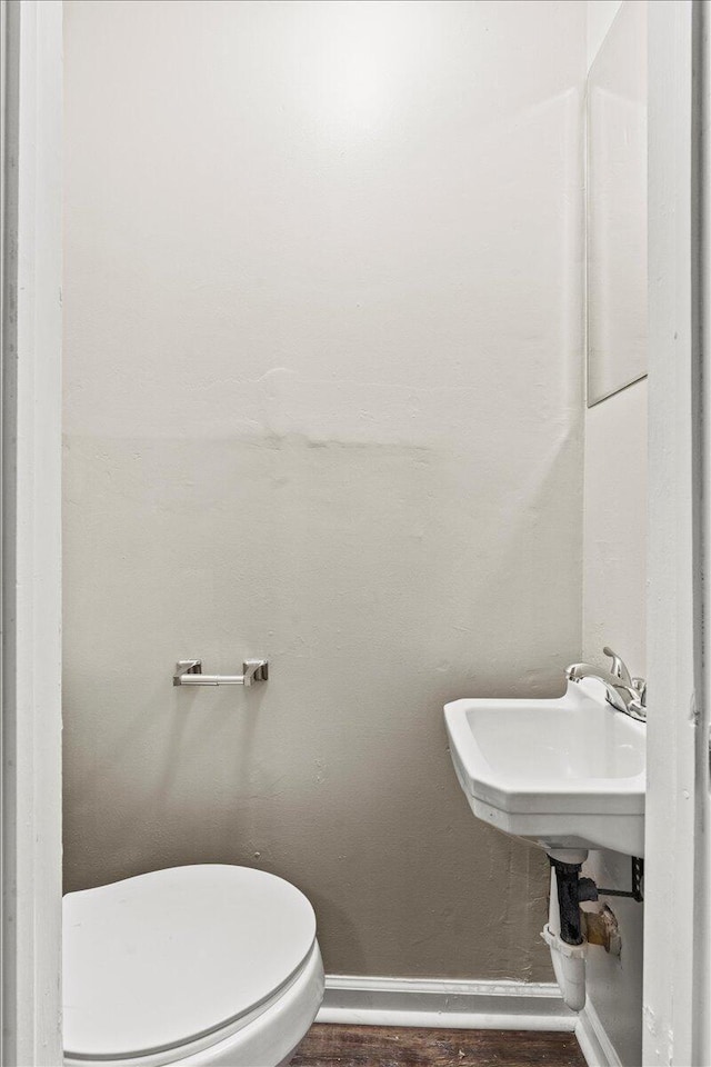 1711 Greenway Dr, Augusta, GA 30909 - bathroom featuring toilet, baseboards, and wood finished floors
