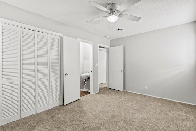 1711 Greenway Dr, Augusta, GA 30909 - unfurnished bedroom featuring carpet floors, visible vents, a closet, baseboards, and ceiling fan