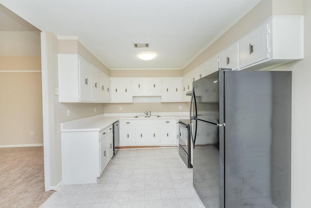 112 W Lynne Dr, Augusta, GA 30907 - kitchen with black appliances, ornamental molding, light countertops, white cabinets, and light carpet
