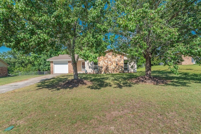 112 W Lynne Dr, Augusta, GA 30907 - view of front facade featuring dirt driveway, an attached garage, and stone siding