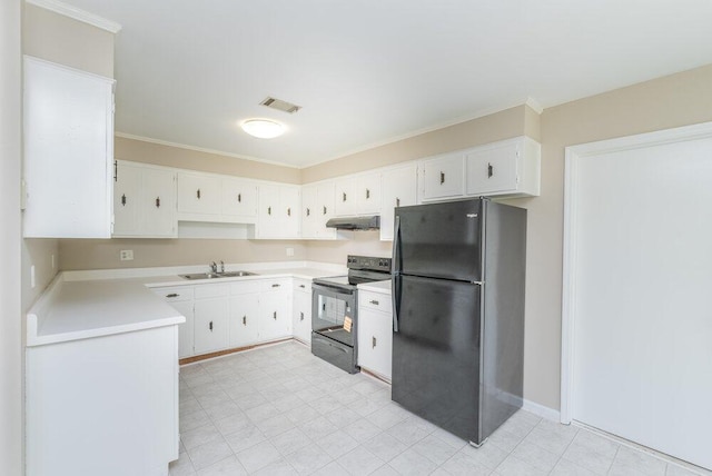 112 W Lynne Dr, Augusta, GA 30907 - kitchen featuring freestanding refrigerator, range with electric stovetop, under cabinet range hood, light countertops, and white cabinetry