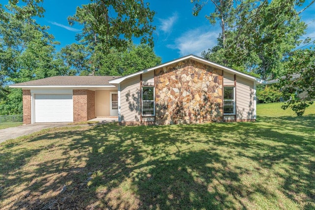 112 W Lynne Dr, Augusta, GA 30907 - view of front facade with a garage, driveway, a front lawn, and stone siding
