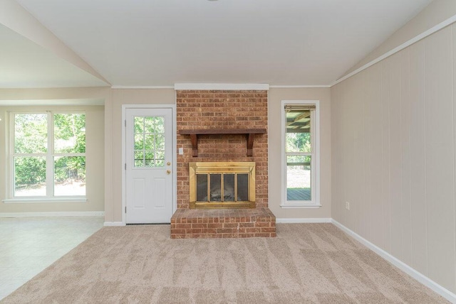 112 W Lynne Dr, Augusta, GA 30907 - unfurnished living room featuring healthy amount of natural light, a fireplace, crown molding, lofted ceiling, and carpet flooring
