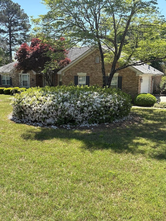 3023 Grey Fox Dr, Hephzibah, GA 30815 - view of yard featuring a garage