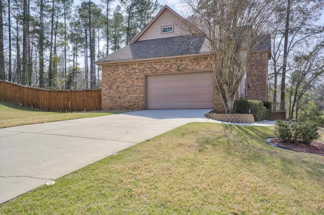 view of home's exterior with roof with shingles, an attached garage, a yard, concrete driveway, and brick siding