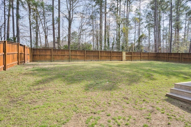 view of yard with a fenced backyard