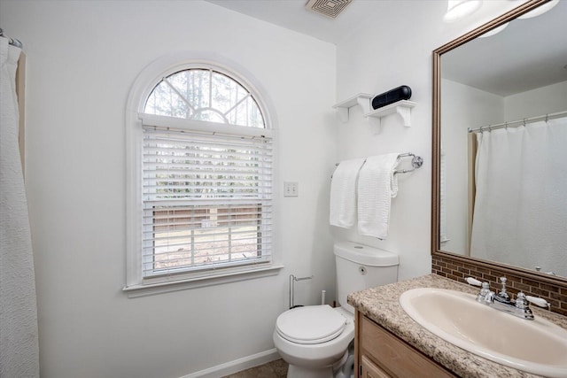 full bath featuring decorative backsplash, toilet, vanity, and visible vents