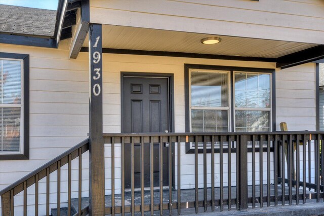 entrance to property with covered porch