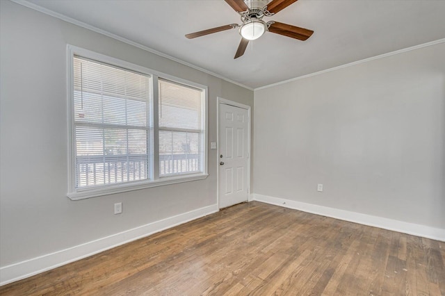 unfurnished room featuring hardwood / wood-style floors, ceiling fan, and ornamental molding