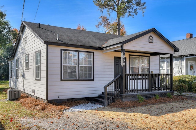 bungalow-style home featuring a porch and central air condition unit