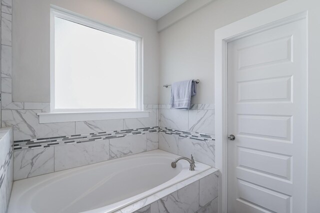 full bath featuring a bath