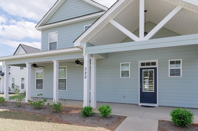 property entrance featuring a ceiling fan and covered porch
