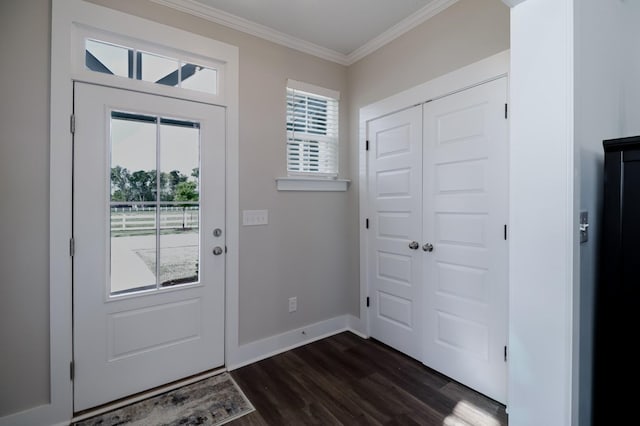 entryway with crown molding, baseboards, and dark wood finished floors