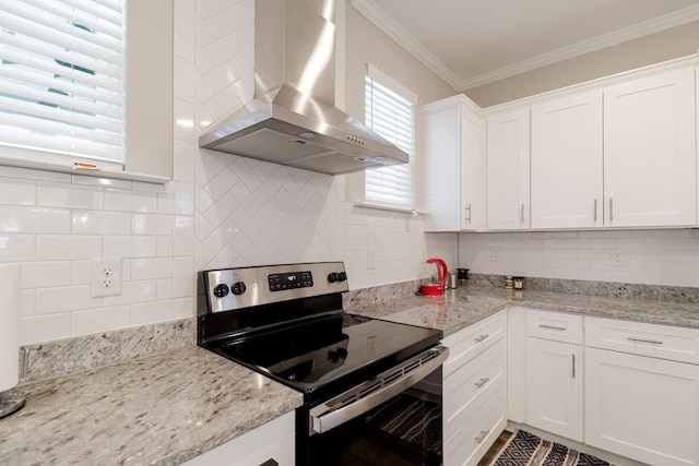 kitchen with crown molding, wall chimney exhaust hood, electric range, white cabinets, and backsplash