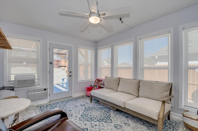 sunroom / solarium featuring ceiling fan and cooling unit