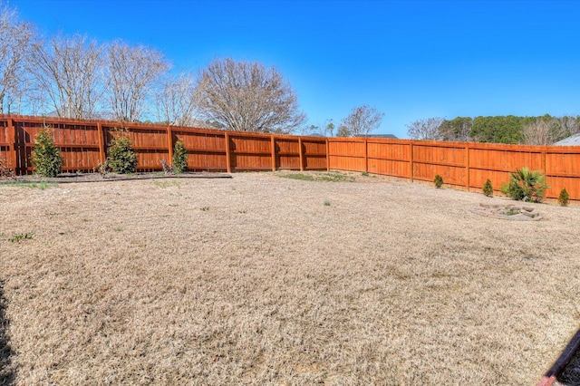 view of yard with a fenced backyard