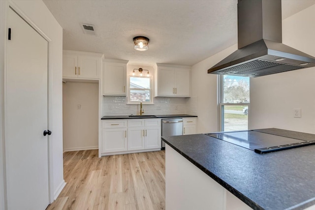 kitchen featuring visible vents, island exhaust hood, a sink, dishwasher, and black electric cooktop