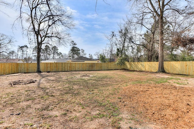 view of yard featuring a fenced backyard