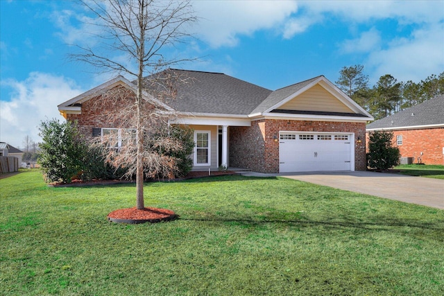 view of front of house with driveway, a garage, a front yard, and brick siding