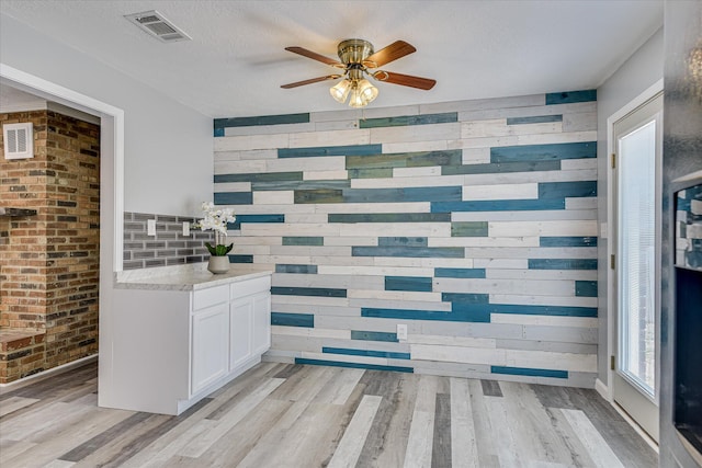 522 Gray Dr, Martinez, GA 30907 - bathroom featuring ceiling fan, wood finished floors, and wooden walls