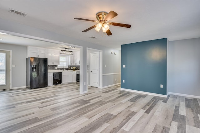 522 Gray Dr, Martinez, GA 30907 - unfurnished living room featuring a sink, ceiling fan, light wood-style flooring, and baseboards