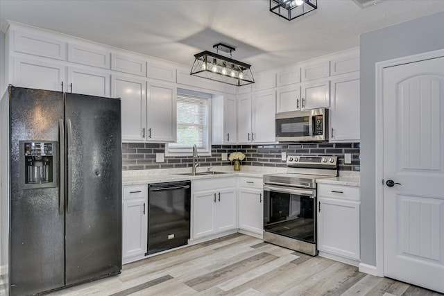 522 Gray Dr, Martinez, GA 30907 - kitchen featuring black appliances, a sink, white cabinets, and decorative backsplash