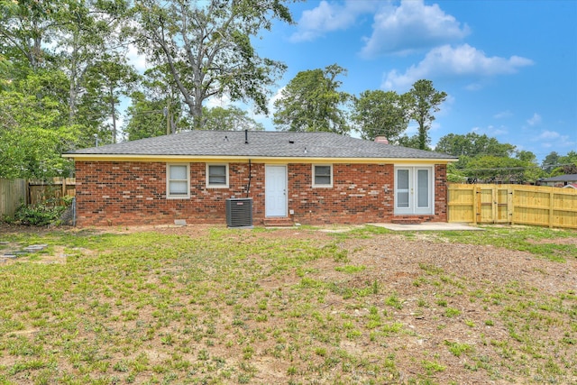 522 Gray Dr, Martinez, GA 30907 - back of house with central air condition unit, brick siding, and a chimney