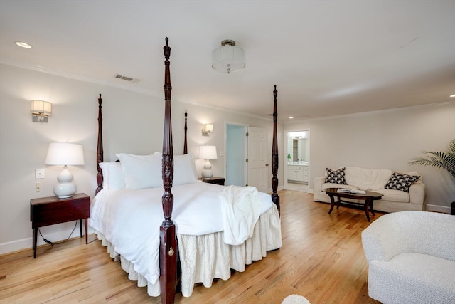 bedroom with crown molding, light wood-style flooring, baseboards, ensuite bathroom, and recessed lighting