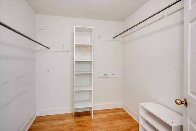spacious closet with light wood finished floors