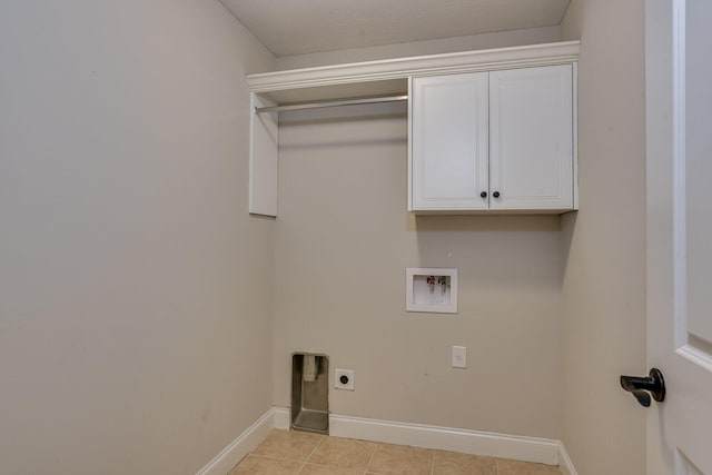 clothes washing area with cabinets, washer hookup, and electric dryer hookup