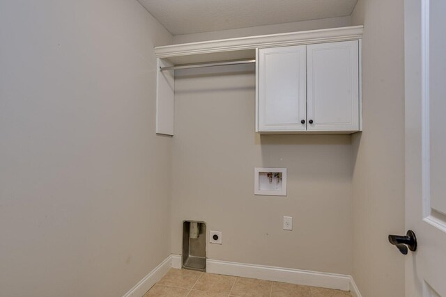 clothes washing area with cabinets, washer hookup, and electric dryer hookup