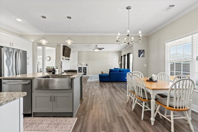 kitchen with a sink, visible vents, a wealth of natural light, and stainless steel appliances