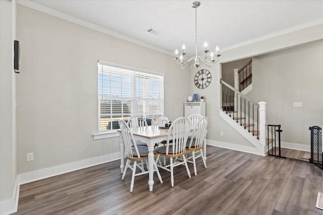 dining space with stairway, wood finished floors, baseboards, and ornamental molding