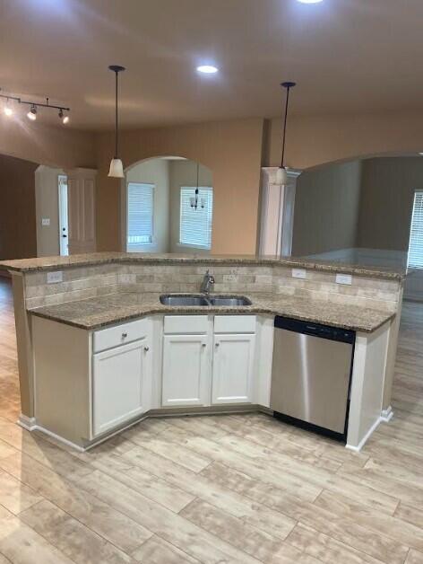 6066 Reynolds Cir, Grovetown, GA 30813 - kitchen featuring dishwasher, hanging light fixtures, light stone counters, white cabinets, and recessed lighting