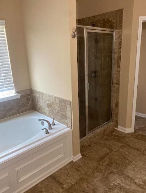 6066 Reynolds Cir, Grovetown, GA 30813 - bathroom featuring a stall shower and a garden tub