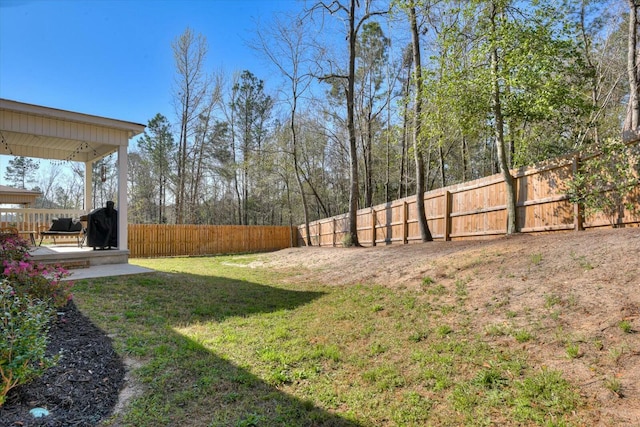 view of yard with a deck and a fenced backyard