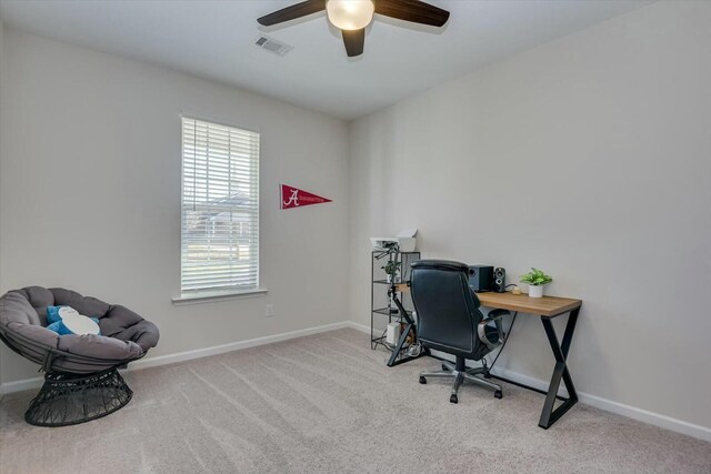 office space with ceiling fan, carpet, visible vents, and baseboards