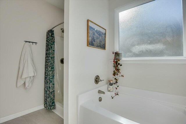 full bathroom with tile patterned flooring and baseboards