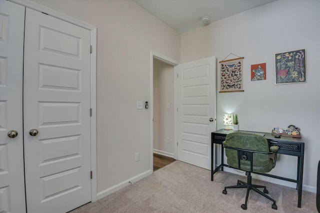 home office featuring carpet flooring and baseboards