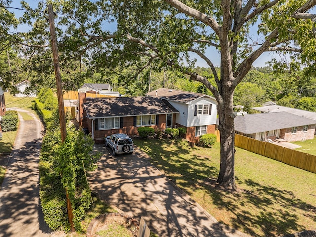2905 Rocky Creek Rd, Augusta, GA 30906 - tri-level home with brick siding, a front lawn, fence, and concrete driveway