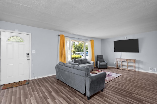 2905 Rocky Creek Rd, Augusta, GA 30906 - living room with visible vents, baseboards, a textured ceiling, and wood finished floors