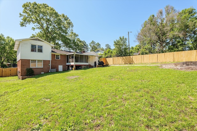 2905 Rocky Creek Rd, Augusta, GA 30906 - view of yard featuring a fenced backyard, central AC, and a sunroom