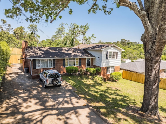 2905 Rocky Creek Rd, Augusta, GA 30906 - split level home featuring driveway, fence, a front lawn, and brick siding