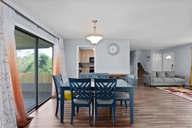 2905 Rocky Creek Rd, Augusta, GA 30906 - dining space featuring a healthy amount of sunlight, wood finished floors, and stairs
