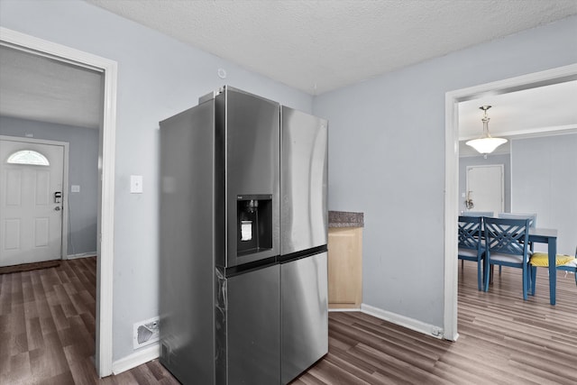 2905 Rocky Creek Rd, Augusta, GA 30906 - kitchen featuring stainless steel fridge with ice dispenser, baseboards, dark wood-style floors, a textured ceiling, and visible vents